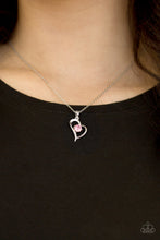 Load image into Gallery viewer, Glistening silver bars fold around a solitaire pink rhinestone, creating a romantic heart pendant below the collar for a timeless look. Features an adjustable clasp closure.  Sold as one individual necklace. Includes one pair of matching earrings.  Always nickel and lead free.