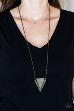 Load image into Gallery viewer, Stamped and studded in indigenous inspired textures, a stacked triangular pendant swings from the bottom of an elongated brass chain for a trendy tribal look. Features an adjustable clasp closure.  Sold as one individual necklace. Includes one pair of matching earrings.  Always nickel and lead free.