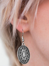 Load image into Gallery viewer, Brushed in an antiqued finish, a shimmery oval frame is embossed in a radiant pattern for a tribal inspired look. Earring attaches to a standard fishhook fitting.  Sold as one pair of earrings. 