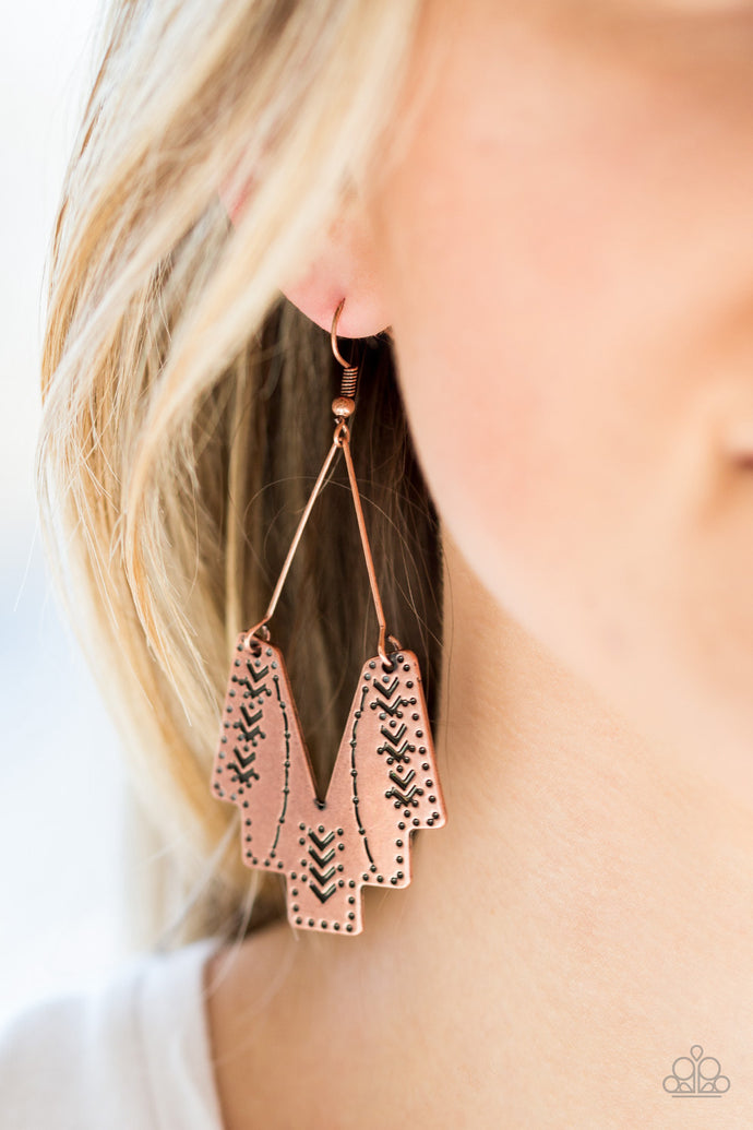 Stamped in tribal inspired patterns, an abstract geometric frame swings from a copper wire fitting for a tribal inspired look. Earrings attaches a standard fishhook fittings.  Sold as one pair of earrings.  Always nickel and lead free.