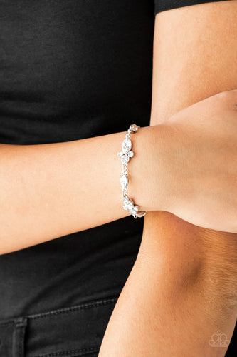 Infused with trios of glassy white rhinestones, glittery white marquise-cut rhinestones link around the wrist for a refined look. Features an adjustable clasp closure.  Sold as one individual bracelet Always nickel and lead free.