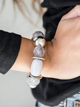 Load image into Gallery viewer, Necklace:  Dramatic silver, neutral gray, and faceted cloudy beads are threaded along an invisible wire below the collar for a seasonal look. Features an adjustable clasp closure.  Bracelet: Dramatic silver, neutral gray, and faceted cloudy beads are threaded along a stretchy elastic band, creating a seasonal look around the wrist.  Sold as one individual necklace, set of earrings, and bracelet.