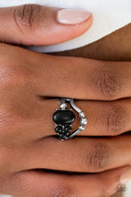 Load image into Gallery viewer, Black stone beads are haphazardly pressed into an arcing silver band for a seasonal look. Silver studs are sprinkled across the swooping bands for a shimmery finish. Features a dainty stretchy band for a flexible fit.  Sold as one individual ring.  