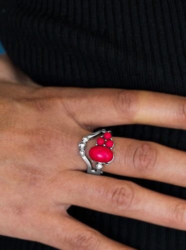 Red stone beads are haphazardly pressed into an arcing silver band for a seasonal look. Silver studs are sprinkled across the swooping bands for a shimmery finish. Features a dainty stretchy band for a flexible fit.  Sold as one individual ring.