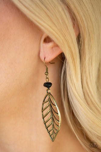An airy brass leaf swings from the bottom of an earthy black pebble, creating a seasonal lure. Earring attaches to a standard fishhook fitting.  Sold as one pair of earrings.  Always nickel and lead free.