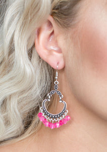 Faceted pink beads swing from the bottom of a studded silver frame, creating a whimsical lure. Earring attaches to a standard fishhook fitting.  Sold as one pair of earrings.