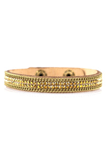 A skinny strand of brown suede is encrusted in rows of glittery aurum rhinestones and shimmery brass chains for a sassy look. Features an adjustable clasp closure. Sold as one individual bracelet.