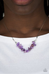 Attached to a dainty silver chain, bits of vivacious purple rock are threaded along an invisible wire below the collar for a seasonal look. Features an adjustable clasp closure.  Sold as one individual necklace. Includes one pair of matching earrings.  Always nickel and lead free.