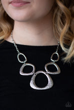 Load image into Gallery viewer, Hammered in a high-sheen finish, asymmetrical silver frames link below the collar in an edgy statement-making fashion. Features an adjustable clasp closure.  Sold as one individual necklace. Includes one pair of matching earrings.  Always nickel and lead free.