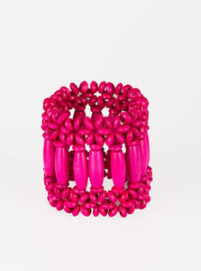  A collection of pink wooden beads are threaded along stretchy bands, coalescing into a vivacious beaded palette for a summery look.  Sold as one individual bracelet.