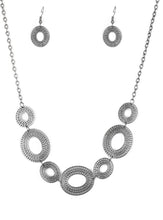 Load image into Gallery viewer, Radiating with circular details, airy oval frames link below the collar for a casual look. Features an adjustable clasp closure.  Sold as one individual necklace. Includes one pair of matching earrings.  Always nickel and lead free.