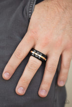 Load image into Gallery viewer, A glistening gold bar arcs across the center of a thick black band for a modern look. Features a stretchy band for a flexible fit.  Sold as one individual ring. Always nickel and lead free.