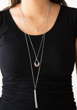 Load image into Gallery viewer, A solitaire pink pearl swings from the uppermost chain, giving way to a teardrop pendant and shimmery silver chain tassel. Dainty white rhinestones and pink pearls collect at the bottom of the centermost pendant for a glamorous finish. Features an adjustable clasp closure.  Sold as one individual necklace. Includes one pair of matching earrings.  Always nickel and lead free.