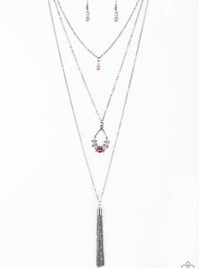 A solitaire pink pearl swings from the uppermost chain, giving way to a teardrop pendant and shimmery silver chain tassel. Dainty white rhinestones and pink pearls collect at the bottom of the centermost pendant for a glamorous finish. Features an adjustable clasp closure.  Sold as one individual necklace. Includes one pair of matching earrings.  Always nickel and lead free.