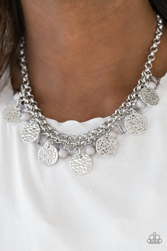 Delicately hammered in shimmery textures, glistening silver discs, polished silver and glassy beading swing from the bottom of a thick silver chain, creating a flirty fringe below the collar. Features an adjustable clasp closure.  Sold as one individual necklace. Includes one pair of matching earrings. Always nickel and lead free.