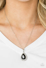 Load image into Gallery viewer, Featuring a regal teardrop cut, a glittery black gem sits atop a silver frame encrusted in glassy white rhinestones. The royal pendant swings below the collar in a glamorous fashion. Features an adjustable clasp closure.  Sold as one individual necklace. Includes one pair of matching earrings.  Always nickel and lead free.