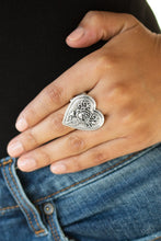Load image into Gallery viewer, Embossed in a romantic rosebud pattern, an over sized silver heart frame adorns the finger for a whimsical fashion. Features a stretchy band for a flexible fit.  Sold as one individual ring.  Always nickel and lead free.