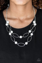 Load image into Gallery viewer, Two rows of white pearls and silver oval frames alternate below the collar, creating luminescent layers. Features an adjustable clasp closure.  Sold as one individual necklace. Includes one pair of matching earrings.  Always nickel and lead free.