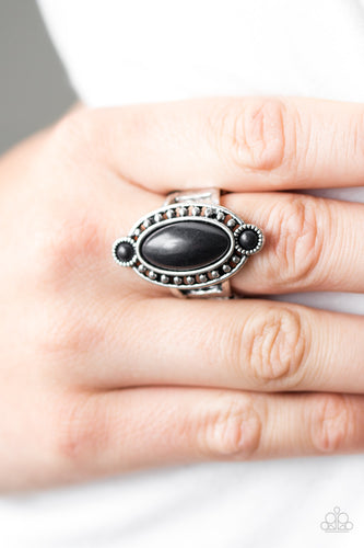 Black stones are pressed into a studded silver frame, creating a southwestern inspired centerpiece. Features a stretchy band for a flexible fit.  Sold as one individual ring.  Always nickel and lead free.