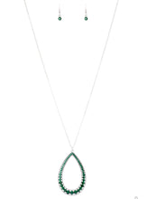 Load image into Gallery viewer, An oversized silver teardrop frame is encrusted in glittery green rhinestones that gradually increase in size at the bottom for a showstopping finish. The sparkling pendant swings from the bottom of a lengthened silver chain for a slimming finish. Features an adjustable clasp closure. Sold as one individual necklace. Includes one pair of matching earrings.
