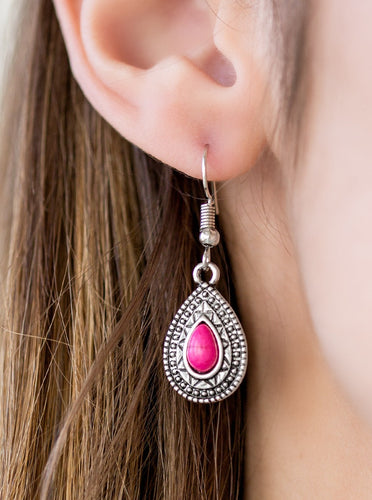 Chiseled into a tranquil teardrop, a vivacious pink stone is pressed into the center of a silver frame radiating with shimmery sunburst details. Earring attaches to a standard fishhook fitting.  Sold as one pair of earrings.
