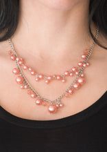 Load image into Gallery viewer, ﻿ Featuring glassy and pearly finishes, dainty coral beads swing from the bottom of layered silver chains, creating a bubbly fringe below the collar. Features an adjustable clasp closure.  Sold as one individual necklace. Includes one pair of matching earrings.  