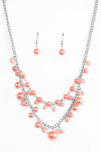 Load image into Gallery viewer, ﻿ Featuring glassy and pearly finishes, dainty coral beads swing from the bottom of layered silver chains, creating a bubbly fringe below the collar. Features an adjustable clasp closure.  Sold as one individual necklace. Includes one pair of matching earrings.