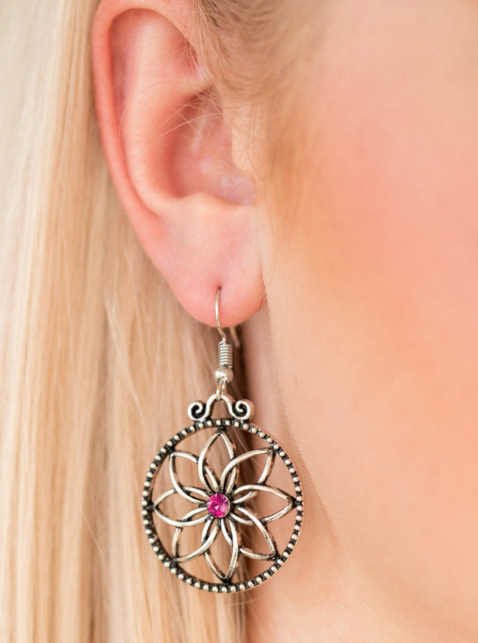 Brushed in an antiqued shimmer, glistening silver bars bend into airy petals. A glittery pink rhinestone dots the floral center for a feminine finish. Earring attaches to a standard fishhook fitting.  Sold as one pair of earrings.