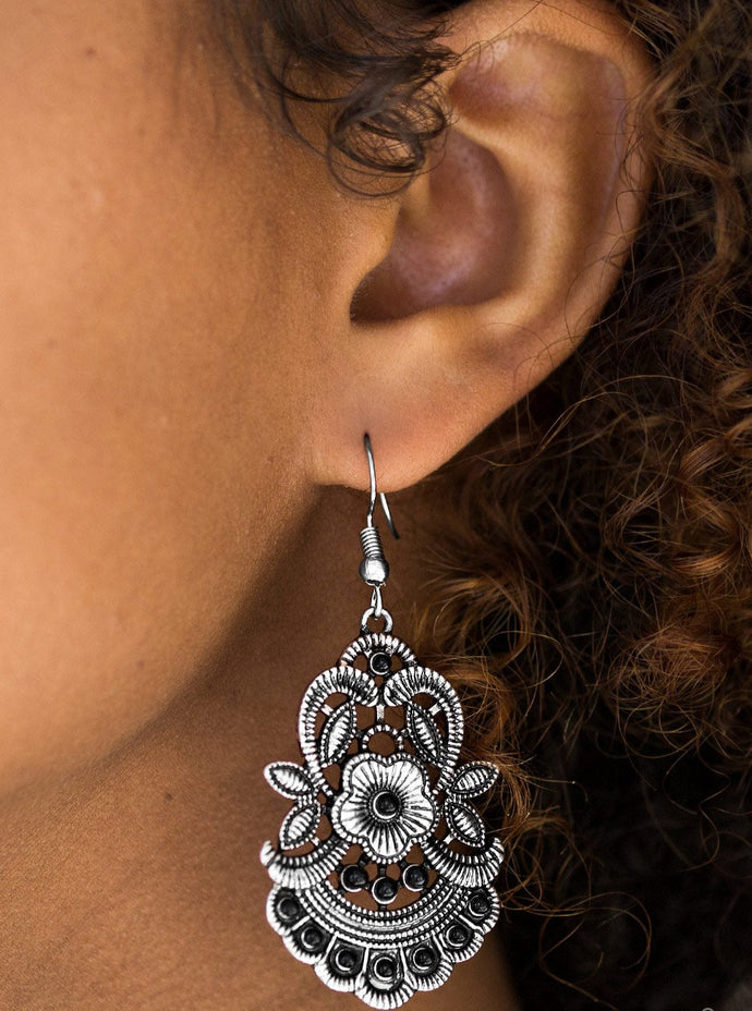 Delicately etched and dotted in tactile textures, leafy silver frames bloom into a summery floral frame. Dainty black beads dot the seasonal frame for a colorful finish. Earring attaches to a standard fishhook fitting.  Sold as one pair of earrings.  