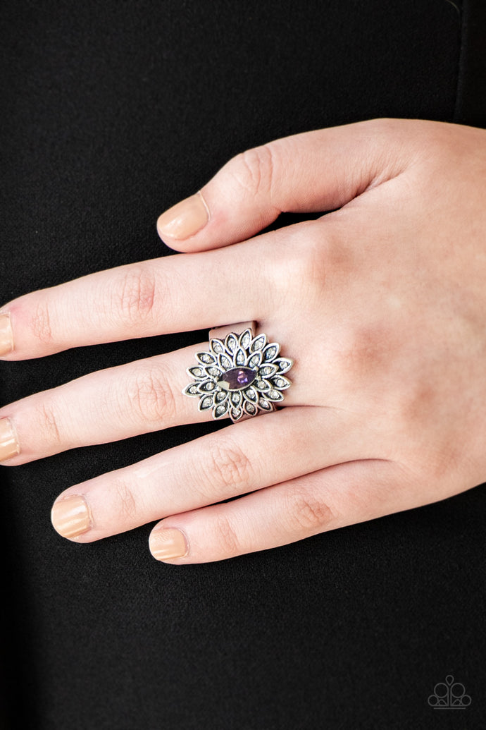 Dotted in dainty white rhinestones, silver petals radiate from a regal purple marquise shaped rhinestone center for an edgy look. Features a stretchy band for a flexible fit.  Sold as one individual ring.  Always nickel and lead free!