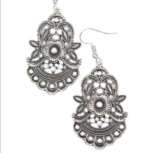 Delicately etched and dotted in tactile textures, leafy silver frames bloom into a summery floral frame. Dainty gray beads dot the seasonal frame for a colorful finish. Earring attaches to a standard fishhook fitting.  Sold as one pair of earrings.