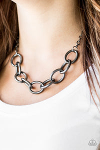 Featuring mismatched textures, bold gunmetal links connect below the collar for a dramatic industrial look. Features an adjustable clasp closure.  Sold as one individual necklace. Includes one pair of matching earrings.  Always nickel and lead free.