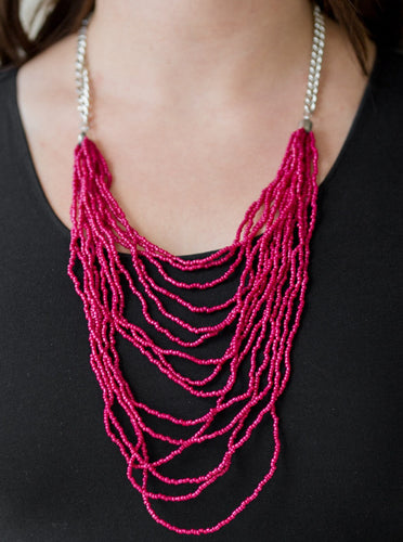 Row after row of pink seed beads cascade down the chest, creating summery layers. Features an adjustable clasp closure.  Sold as one individual necklace. Includes one pair of matching earrings. 