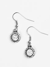 Load image into Gallery viewer, A glittery white rhinestone is pressed into a dainty silver frame. Dazzling white rhinestones are sprinkled around the beaming center, adding a refined shimmer to the timeless frame. Earring attaches to a standard fishhook fitting.  Sold as one pair of earrings.