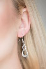 Load image into Gallery viewer, A glistening silver ribbon loops into an asymmetrical infinity frame for a refined look. Earring attaches to a standard fishhook fitting.  Sold as one pair of earrings.  Always nickel and lead free.