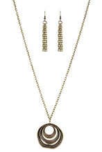 Load image into Gallery viewer, Hammered in an array of mismatched textures, three asymmetrical hoops join into an abstract pendant at the bottom of a lengthened brass chain for a handcrafted look. Features an adjustable clasp closure.  Sold as one individual necklace. Includes one pair of matching earrings.