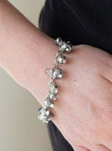 Load image into Gallery viewer, Faceted silver and hematite crystal-like beads swing from a shimmery silver chain, creating a fierce fringe around the wrist. Features an adjustable clasp closure.  Sold as one individual bracelet.   