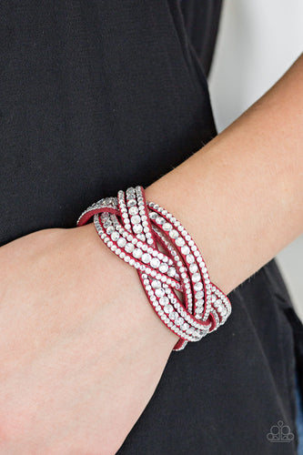 Varying in size, glassy white rhinestones are encrusted along interwoven red suede bands, creating blinding shimmer across the wrist. Features an adjustable snap closure.  Sold as one individual bracelet.  Always nickel and lead free.
