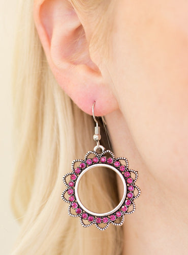 Textured silver petals flare from a pink rhinestone encrusted ring, creating a whimsical lure. Earring attaches to a standard fishhook fitting.  Sold as one pair of earrings.  