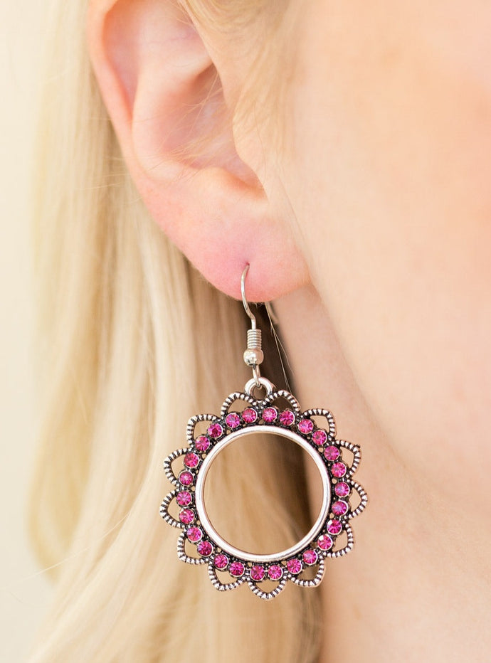 Textured silver petals flare from a pink rhinestone encrusted ring, creating a whimsical lure. Earring attaches to a standard fishhook fitting.  Sold as one pair of earrings.  