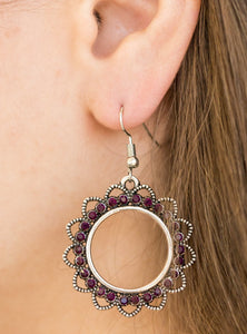 Textured silver petals flare from a purple rhinestone encrusted ring, creating a whimsical lure. Earring attaches to a standard fishhook fitting.  Sold as one pair of earrings.  
