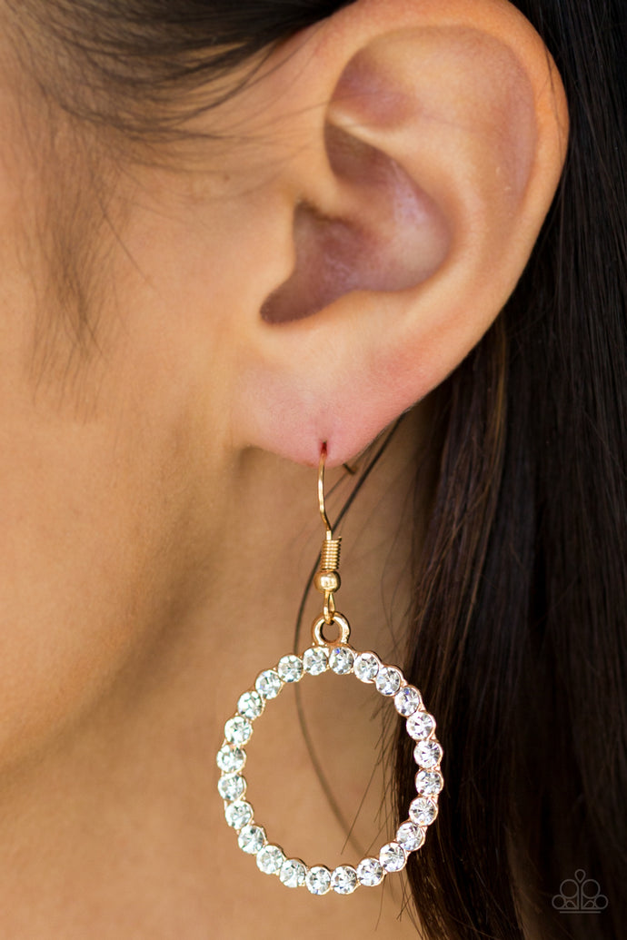 Glittery white rhinestones are encrusted along a circular gold frame, creating a bubbly frame. Earring attaches to a standard fishhook fitting.  Sold as one pair of earrings.  