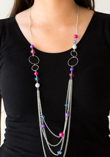 Infused with shimmery silver hoops, glassy and polished multicolored beads trickle along glistening silver chains for a bubbly look. Features an adjustable clasp closure.  Sold as one individual necklace. Includes one pair of matching earrings.