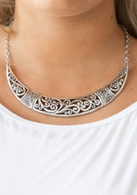 Load image into Gallery viewer, Swirling with ornate filigree filled detail, a shimmery silver crescent plate swings below the collar for a fierce look. Features an adjustable clasp closure.  Sold as one individual necklace. Includes one pair of matching earrings.  Always nickel and lead free.