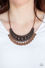 Load image into Gallery viewer, Antiqued copper discs swing from the bottom of an ornate half-moon copper pendant, creating a noise-making fringe below the collar. Features an adjustable clasp closure.  Featured inside The Preview at ONE Life!  Sold as one individual necklace. Includes one pair of matching earrings. Always nickel and lead free.