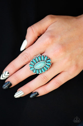 Vivacious turquoise stones are pressed into a studded silver frame, coalescing into a whimsical floral centerpiece atop the finger. Features a stretchy band for a flexible fit.  Sold as one individual ring.  Always nickel and lead free.