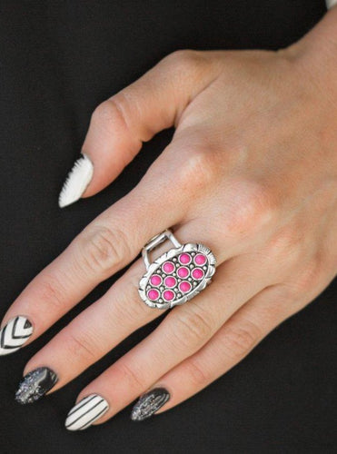 Dainty pink stones are sprinkled across the front of a studded silver frame, creating a refreshing centerpiece atop the finger. Features a stretchy band for a flexible fit.  Sold as one individual ring.  