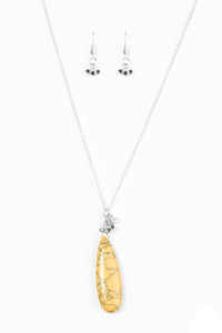Chiseled into a tranquil teardrop, a yellow stone swings from the bottom of an elongated silver chain for a seasonal look. Dainty silver cube beading slides along the chain, adding hints of metallic shimmer to the earthy pendant. Features an adjustable clasp closure.  Sold as one individual necklace. Includes one pair of matching earrings.