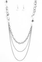 Load image into Gallery viewer, Polished white and faceted silver beads trickle along shimmery silver hoops for an asymmetrical look. The colorful beading gives way to layers of shimmery silver chain for a seasonal finish. Features an adjustable clasp closure.  Sold as one individual necklace. Includes one pair of matching earrings.