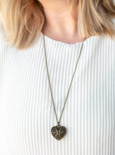 Load image into Gallery viewer, Encrusted in glittery black rhinestones, a vintage inspired heart pendant swings from the bottom of a shimmery brass chain for a romantic fashion. Features an adjustable clasp closure.  Sold as one individual necklace. Includes one pair of matching earrings.  Always nickel and lead free.